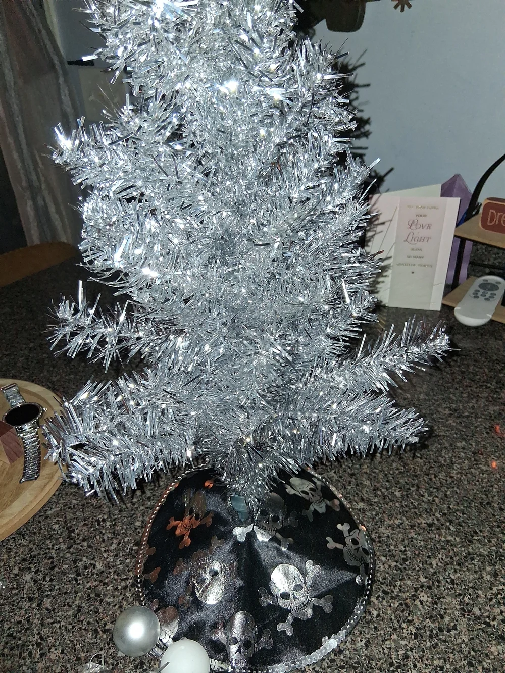 Silver Tinsel Holiday Tree with Black Skull Tree Skirt